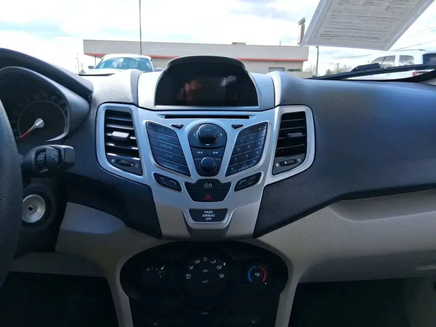 2013 Ford Fiesta SE (3FADP4BJXDM) with an 1.6L I-4 DOHC engine, located at 1951 S Dayton Lakeview Rd., New Carlisle, OH, 45344, (937) 908-9800, 39.890999, -84.050255 - Need a smart, efficient commuter that's easy to park downtown, nimble on I70, and still comfortable for weekend errands or a quick getaway to Springfield or Dayton? This 2013 Ford Fiesta SE Sedan in Oxford White delivers practical daily driving with the kind of budget-friendly ownership that fits re - Photo#13