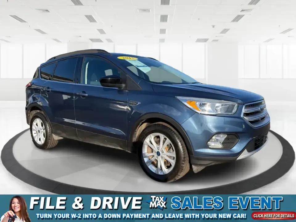 2018 Ford Escape SE (1FMCU9GD4JU) with an 1.5L L4 DOHC 16V engine, 6A transmission, located at 880 E. National Road, Vandalia, OH, 45377, (937) 908-9800, 39.891918, -84.183594 - Picture your next Ohio weekend: loading up the kids for a splash at Splash Xenia, cruising out to John Bryan State Park for a hike, or tackling a snowy morning commute from Beavercreek to downtown Dayton with confidence. This 2018 Ford Escape SE in Blue Metallic is the kind of compact SUV that fits - Photo#0