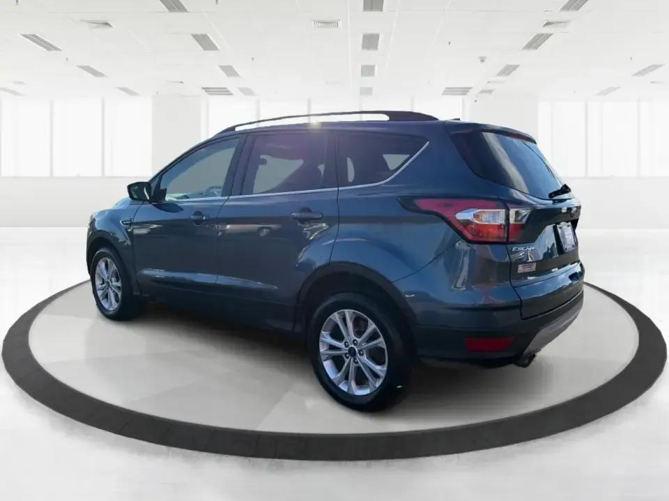 2018 Ford Escape SE 4WD (1FMCU9GD4JU) with an 1.5L L4 DOHC 16V engine, 6A transmission, located at 1951 S Dayton Lakeview Rd., New Carlisle, OH, 45344, (937) 908-9800, 39.890999, -84.050255 - Picture your next Ohio week looking easier: a confident commuter for I-70 runs, a comfortable family hauler for school drop-offs, and a ready-for-any-weather SUV for weekend trips out toward Springfield, Dayton, or a quick getaway to Buck Creek State Park. This 2018 Ford Escape SE 4WD fits that real- Photo#4