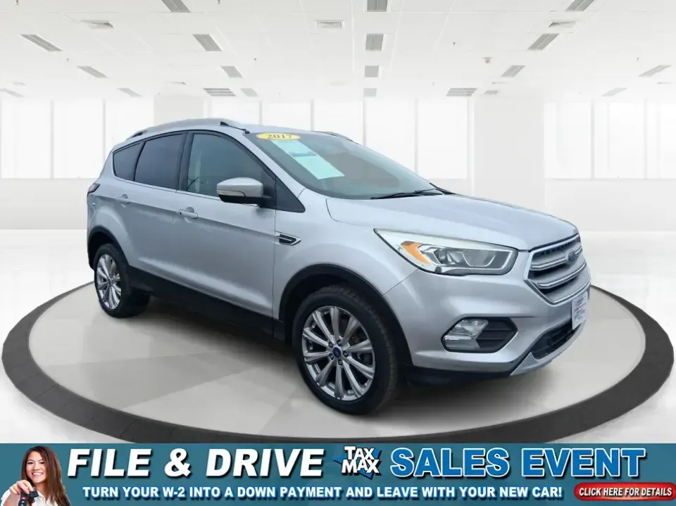 2017 Ford Escape Titanium (1FMCU9J9XHU) with an 2.0L L4 DOHC 16V engine, 6A transmission, located at 4508 South Dixie Dr, Moraine, OH, 45439, (937) 908-9800, 39.689976, -84.218452 - Picture your next Ohio weekend: a comfortable SUV loaded with gear, cruising down I-75 for a quick Dayton outing, then turning toward the MetroParks for a hike-without worrying about winter weather, tight parking lots, or long-drive fatigue. This 2017 Ford Escape Titanium is built for real life in M - Photo#0